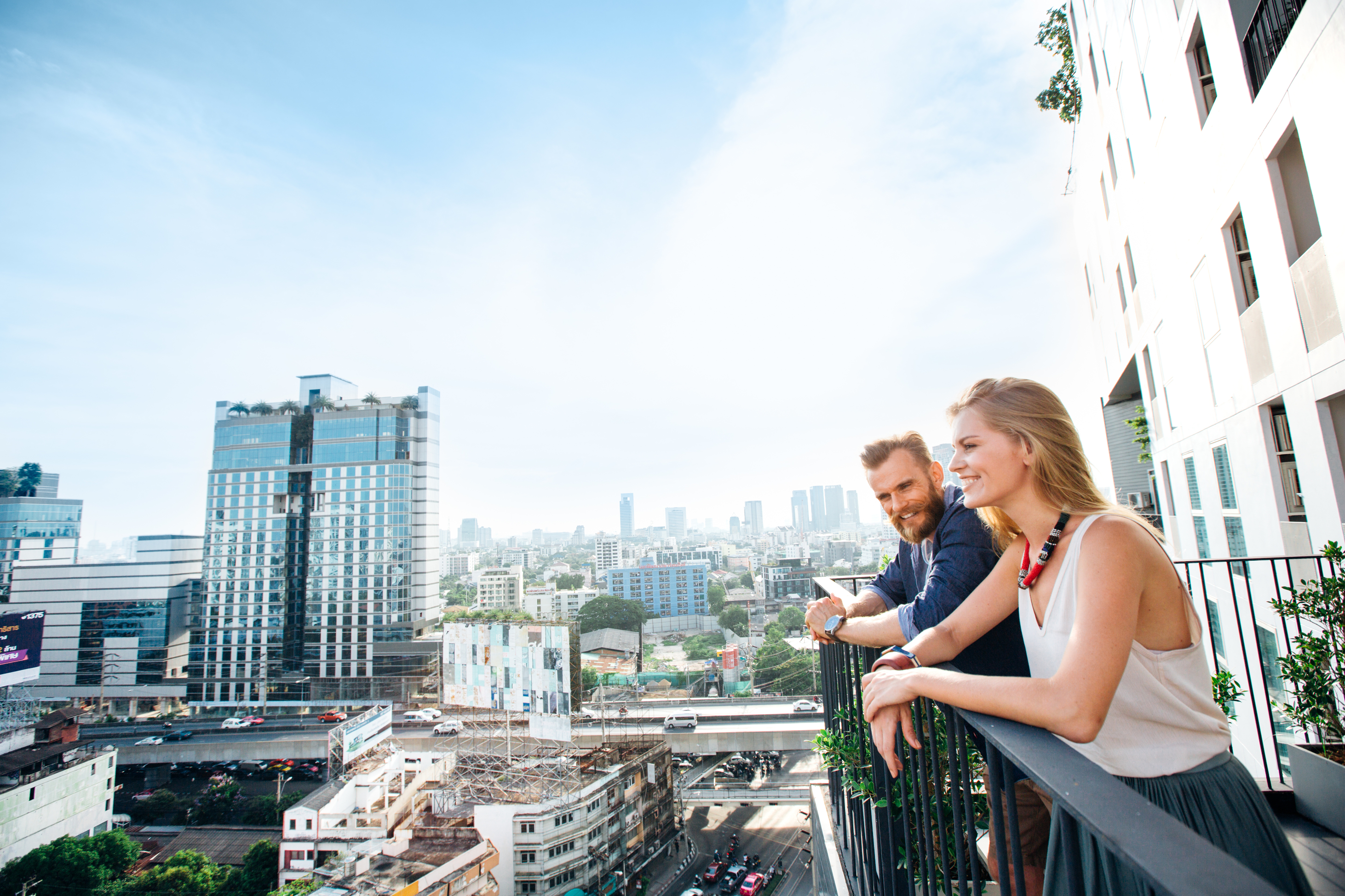 Residents enjoying their apartment balcony